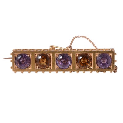Lot 227 - An amethyst and citrine bar brooch.