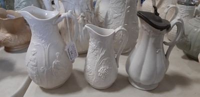 Lot 39 - Nine white stoneware jugs