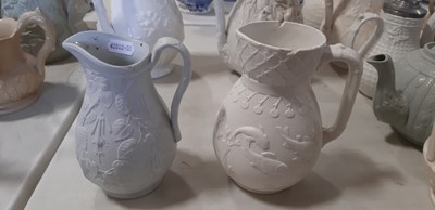 Lot 39 - Nine white stoneware jugs