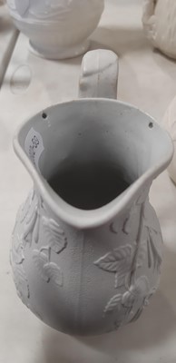 Lot 39 - Nine white stoneware jugs