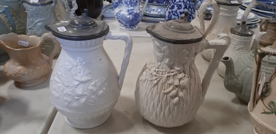 Lot 39 - Nine white stoneware jugs