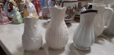 Lot 39 - Nine white stoneware jugs