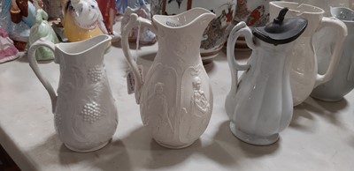Lot 39 - Nine white stoneware jugs