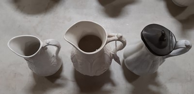 Lot 39 - Nine white stoneware jugs