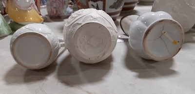 Lot 39 - Nine white stoneware jugs