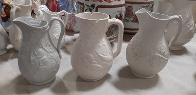 Lot 39 - Nine white stoneware jugs