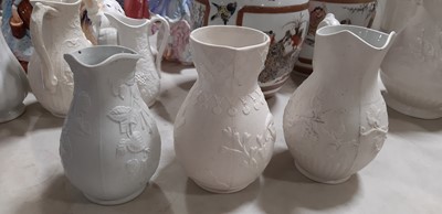 Lot 39 - Nine white stoneware jugs