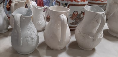 Lot 39 - Nine white stoneware jugs
