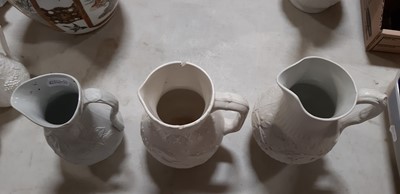 Lot 39 - Nine white stoneware jugs
