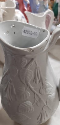 Lot 39 - Nine white stoneware jugs