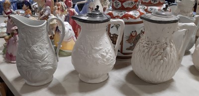 Lot 39 - Nine white stoneware jugs