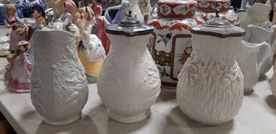 Lot 39 - Nine white stoneware jugs