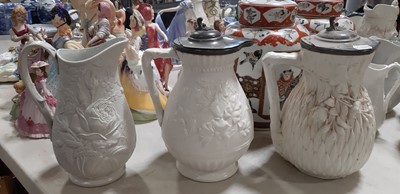 Lot 39 - Nine white stoneware jugs