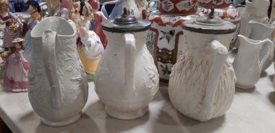 Lot 39 - Nine white stoneware jugs