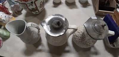 Lot 39 - Nine white stoneware jugs