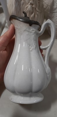 Lot 39 - Nine white stoneware jugs