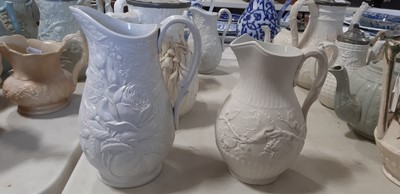 Lot 39 - Nine white stoneware jugs
