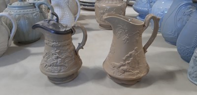 Lot 41 - Six buff-coloured relief-moulded jugs