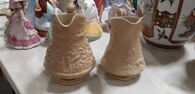 Lot 41 - Six buff-coloured relief-moulded jugs