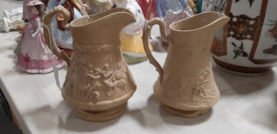 Lot 41 - Six buff-coloured relief-moulded jugs