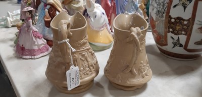 Lot 41 - Six buff-coloured relief-moulded jugs