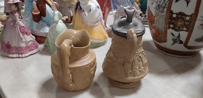 Lot 41 - Six buff-coloured relief-moulded jugs