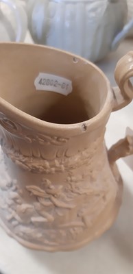 Lot 41 - Six buff-coloured relief-moulded jugs