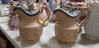 Lot 41 - Six buff-coloured relief-moulded jugs