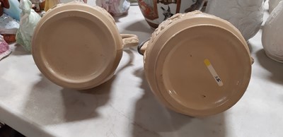 Lot 41 - Six buff-coloured relief-moulded jugs