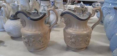 Lot 41 - Six buff-coloured relief-moulded jugs