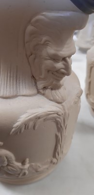 Lot 41 - Six buff-coloured relief-moulded jugs