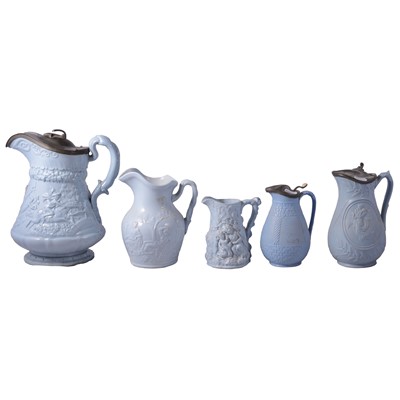 Lot 137 - Five blue stoneware relief-moulded jugs
