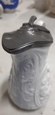 Lot 42 - Six relief-moulded jugs