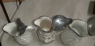 Lot 42 - Six relief-moulded jugs