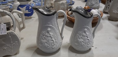 Lot 42 - Six relief-moulded jugs