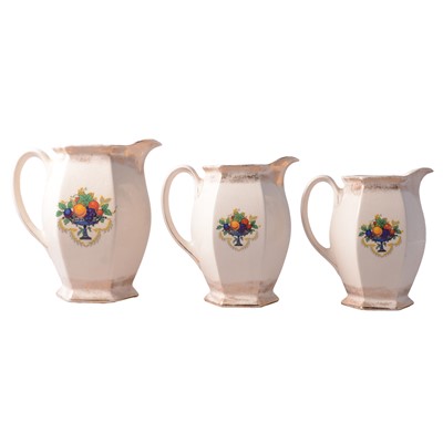 Lot 102 - Three Staffordshire graduating jugs