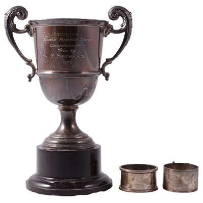 Lot 323 - Silver twin-handled trophy cup, Adie Brothers Ltd, Birmingham 1937, silver and metal napkin rings.