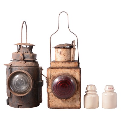 Lot 238 - Railwayana: Adlake's handsignal lamp, and another railway lamp, and two telegraph insulators