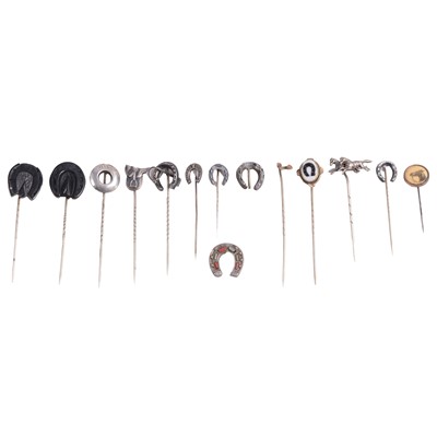 Lot 353 - Thirteen white metal and jet horse-related stick pins.