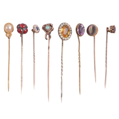 Lot 344 - Nine gemset stick pins, opal, saphiret, amethyst, sapphire.