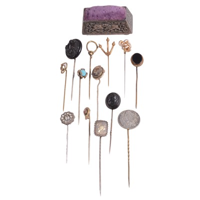 Lot 356 - A collection of gold-plated, white metal, and gilt metal stick pins, and a white metal pin cushion.