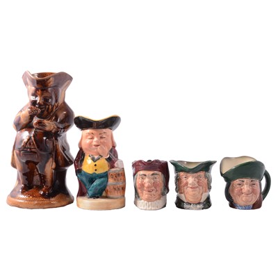 Lot 57 - Two treacle-glazed Mr Toby taking snuff toby jugs, and other Toby and character jugs
