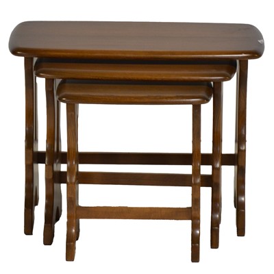 Lot 377 - Nest of three Ercol elm tables