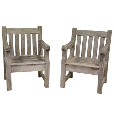 Lot 538 - Set of four teak garden armchairs