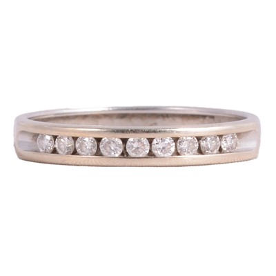 Lot 107 - A diamond half eternity ring.