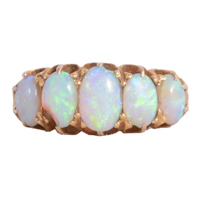 Lot 26 - An opal five stone ring.
