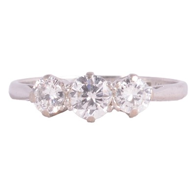 Lot 74 - A diamond three stone ring.