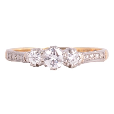 Lot 75 - A diamond three stone ring.