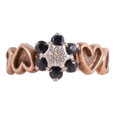Lot 35 - A sapphire and diamond cluster ring.