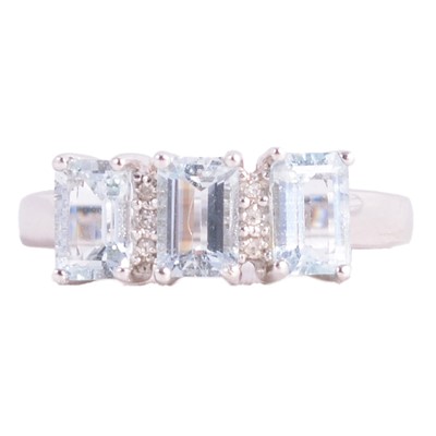 Lot 22 - A heat treated blue topaz and diamond ring.